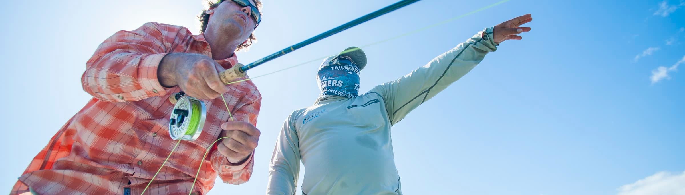 Two anglers casting on a saltwater flat
