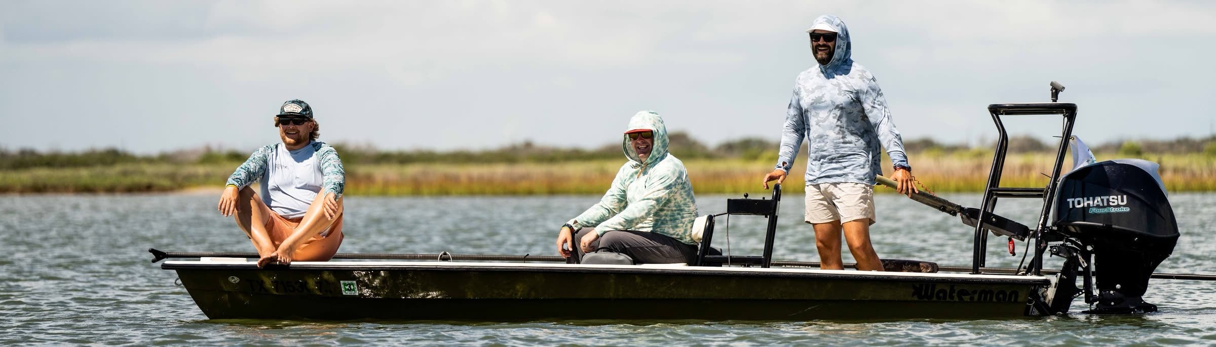 A flats skiff being poled across a Texas coast bay